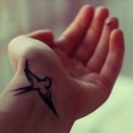 Bird wrist tattoo