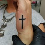 Cross tattoo on you hand
