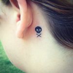 Skull tattoo behind ear