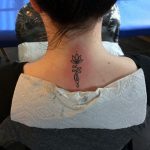 Lotus neck tattoo