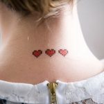 Mini red heart neck tattoo