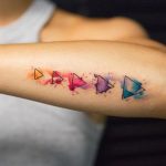 five color triangle tattoo on arm